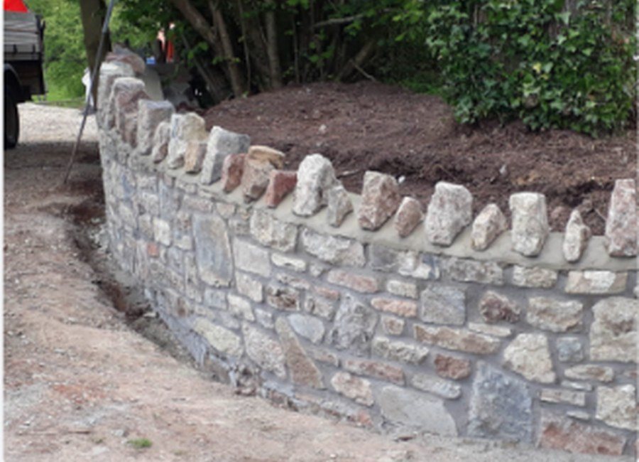Stone boundary wall by Oakhill Building Services