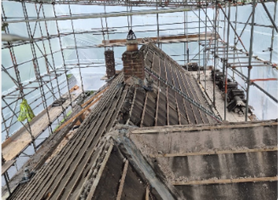 Roof repair work with scaffolding